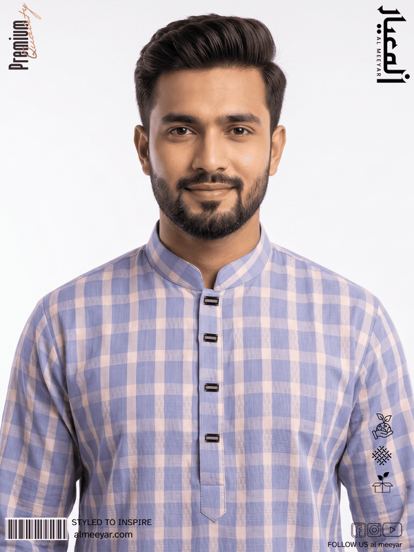 Man wearing a blue and white checkered shirt with a brand logo on the sleeve.