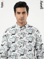 Man wearing a patterned shirt with visible branding on a white background