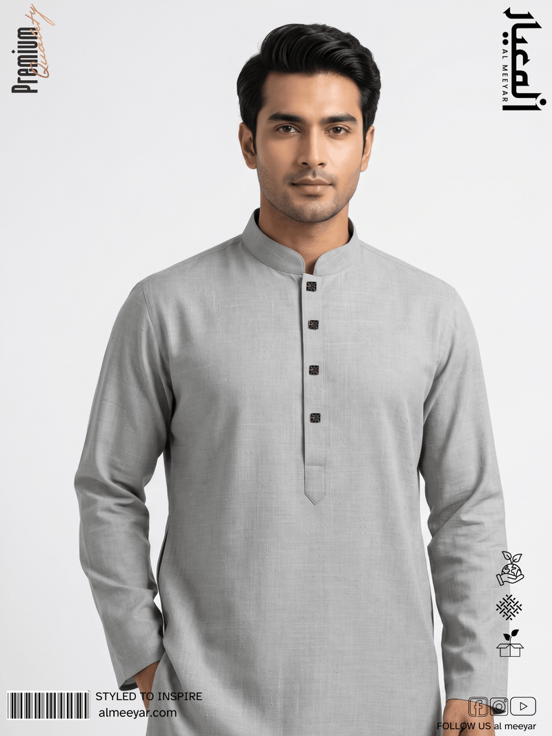 Man wearing a gray kurta with black buttons on a white background